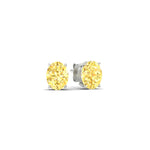 Load image into Gallery viewer, 1-carat-oval-cut-vivid-yellow-diamond-stud-earrings-in-white-gold-fdear10411ovgvyellowangle1-1.00ct-nl-wg.jpg