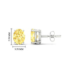 Load image into Gallery viewer, 2-carat-oval-cut-vivid-yellow-diamond-stud-earrings-in-white-gold-fdear10411ovgvyellowangle2-2.00ct-nl-wg-hw.jpg