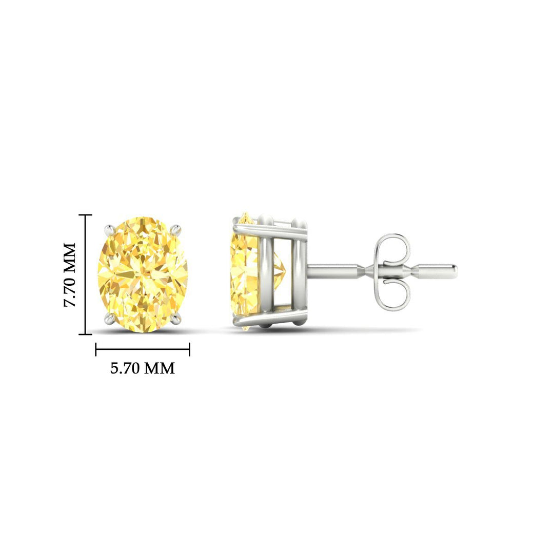 2-carat-oval-cut-vivid-yellow-diamond-stud-earrings-in-white-gold-fdear10411ovgvyellowangle2-2.00ct-nl-wg-hw.jpg