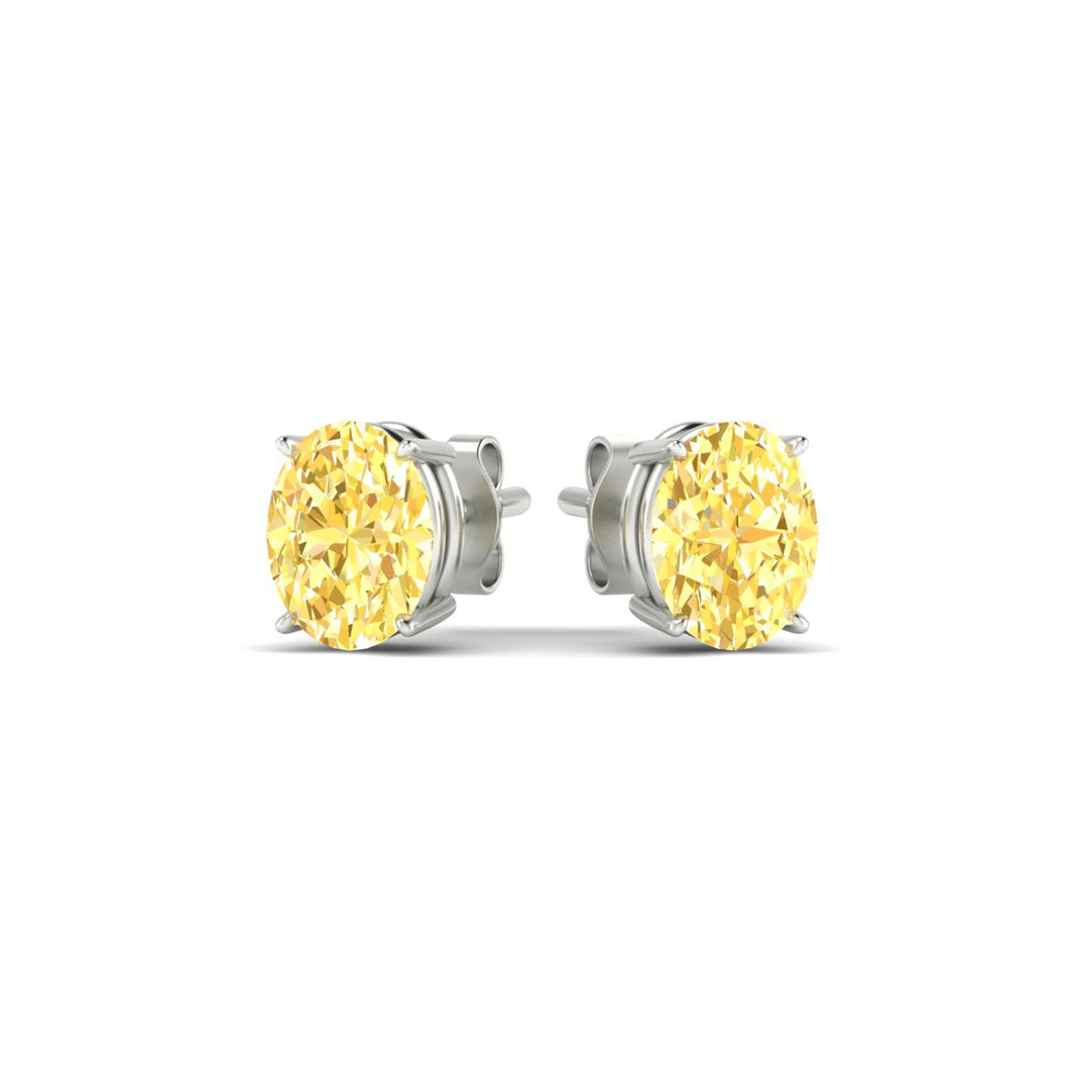 2-carat-oval-cut-vivid-yellow-diamond-stud-earrings-in-white-gold-fdear10411ovgvyellowangle3-2.00ct-nl-wg.jpg