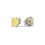 Load image into Gallery viewer, 2-carat-oval-cut-vivid-yellow-diamond-stud-earrings-in-white-gold-fdear10411ovgvyellowangle4-2.00ct-nl-wg.jpg