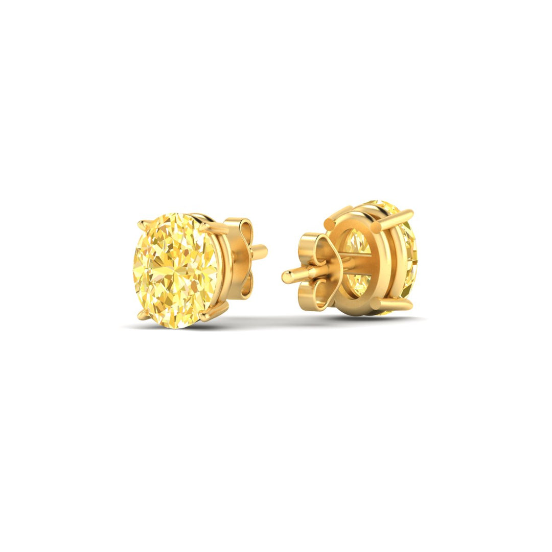 2-carat-oval-cut-vivid-yellow-diamond-stud-earrings-in-yellow-gold-fdear10411ovgvyellowangle4-2.00ct-nl-yg.jpg