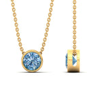 Load image into Gallery viewer, https://www.fascinatingdiamonds.com/cdn/shop/files/2-ct-fancy-lab-grown-round-vived-blue-bezel-stone-pendant-in-yellow-gold-fdpd10538rogvblueangle3-2.00ct-nl-yg_480x480.jpg?v=1786099108