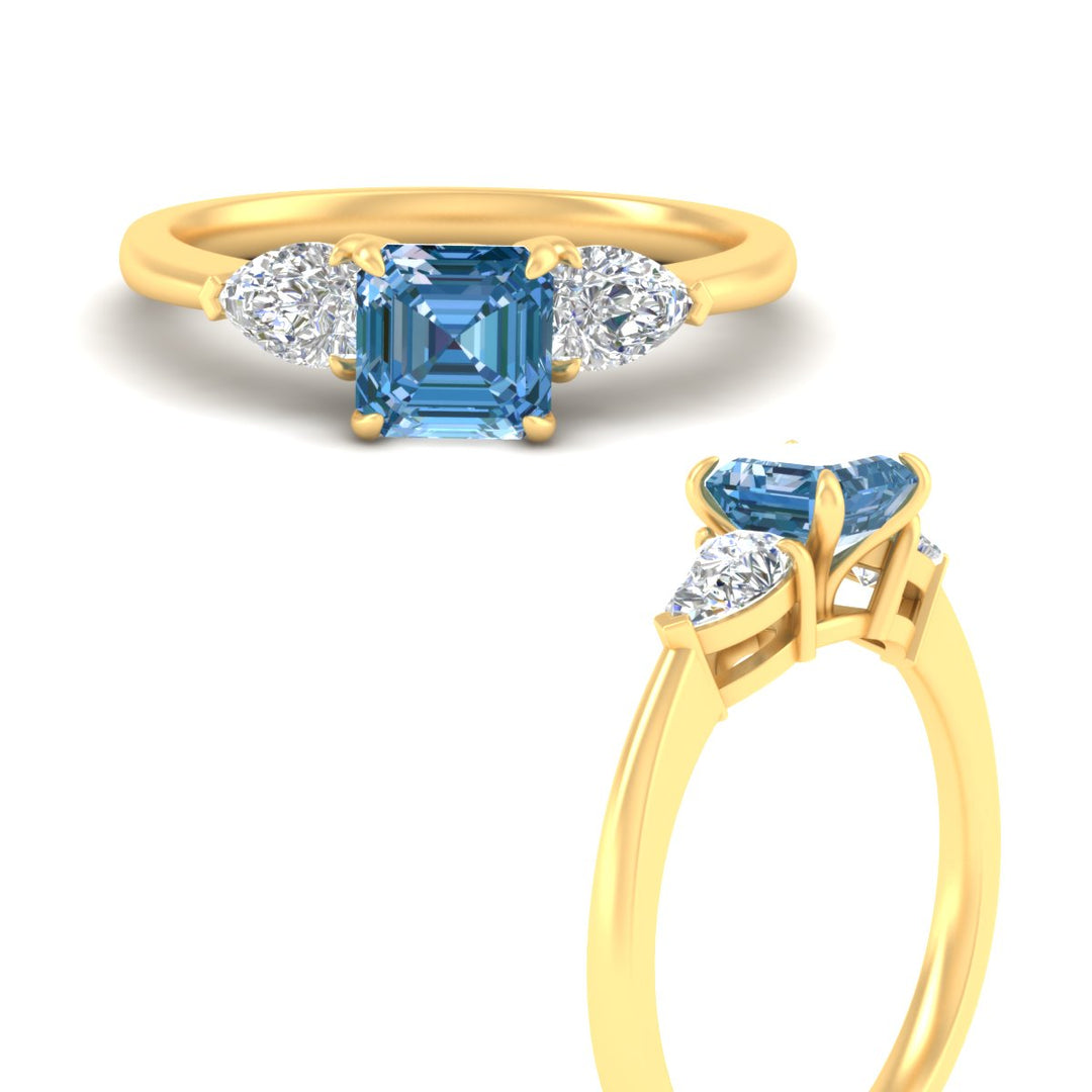3-stone-vivid-blue-asscher-cut-cathedral-ring-in-yellow-gold-fdenr9210asgvblueangle3-nl-yg.jpg