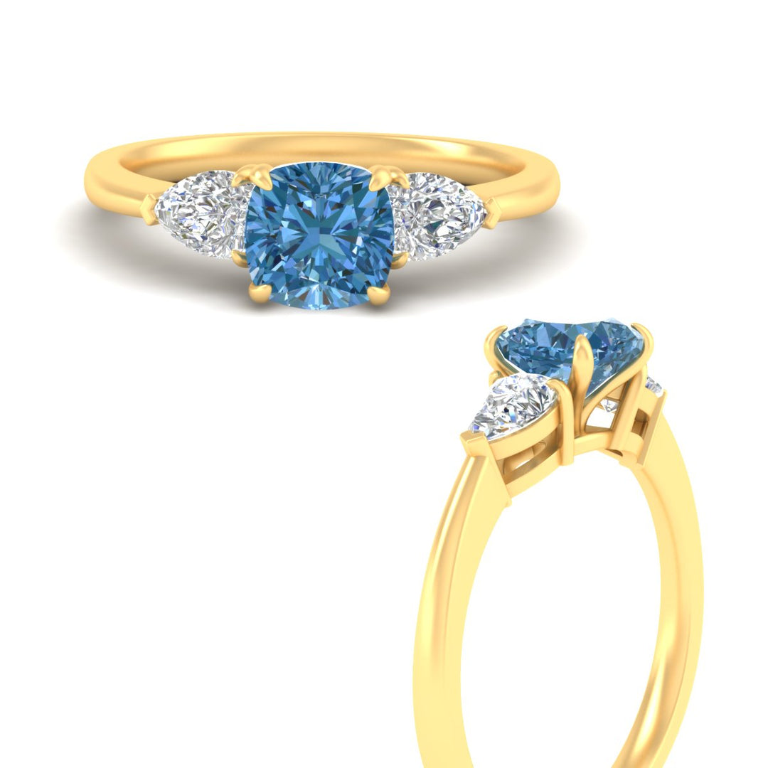 3-stone-vivid-blue-cushion-cut-cathedral-ring-in-yellow-gold-fdenr9210cugvblueangle3-nl-yg.jpg