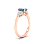 Load image into Gallery viewer, 3-stone-vivid-blue-emerald-cut-cathedral-ring-in-rose-gold-fdenr9210emgvblueangle2-nl-rg.jpg