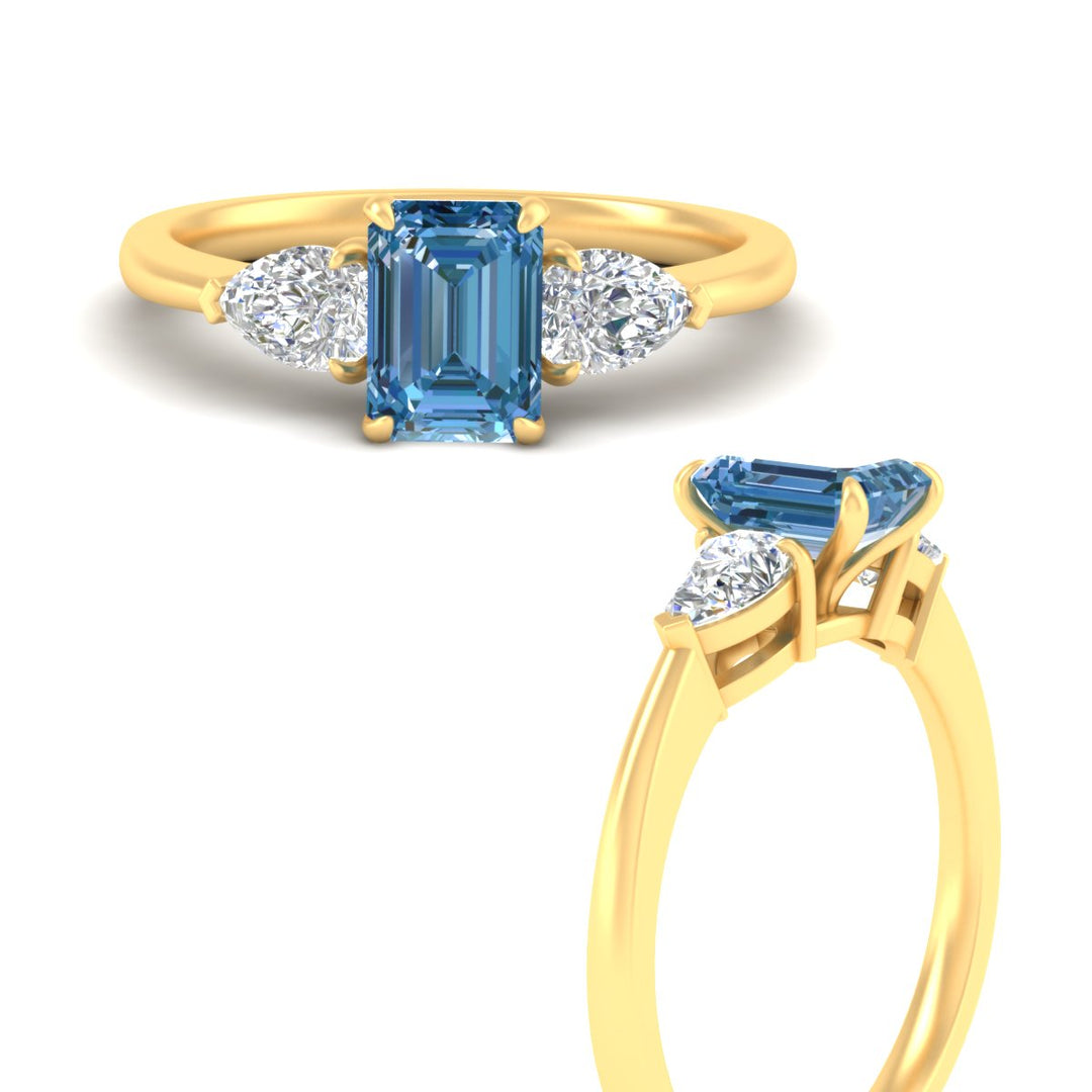 3-stone-vivid-blue-emerald-cut-cathedral-ring-in-yellow-gold-fdenr9210emgvblueangle3-nl-yg.jpg