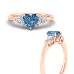 Load image into Gallery viewer, 3-stone-vivid-blue-heart-shaped-cathedral-ring-in-rose-gold-fdenr9210htgvblueangle3-nl-rg.jpg