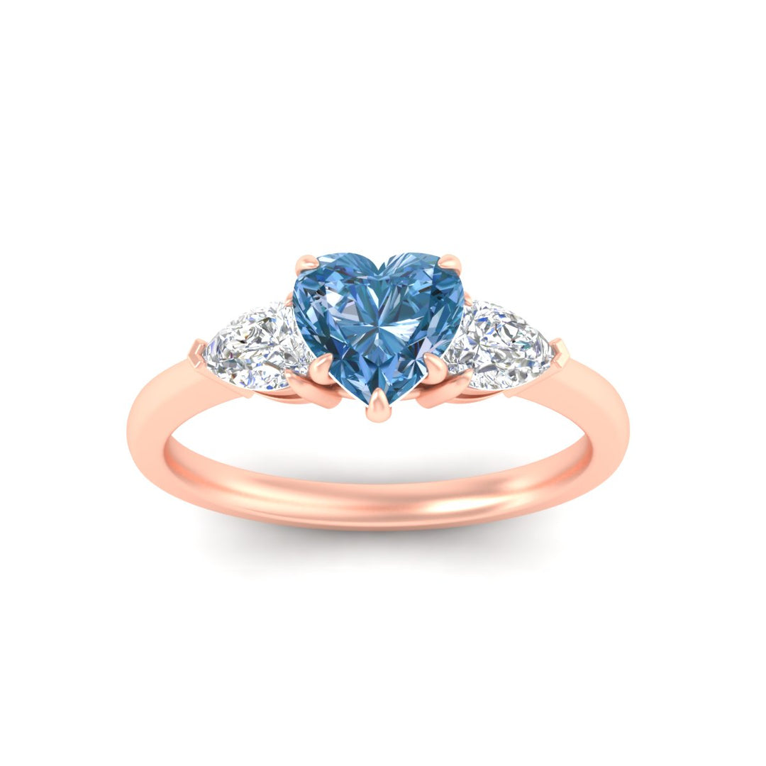 3-stone-vivid-blue-heart-shaped-cathedral-ring-in-rose-gold-fdenr9210htgvblueangle5-nl-rg.jpg