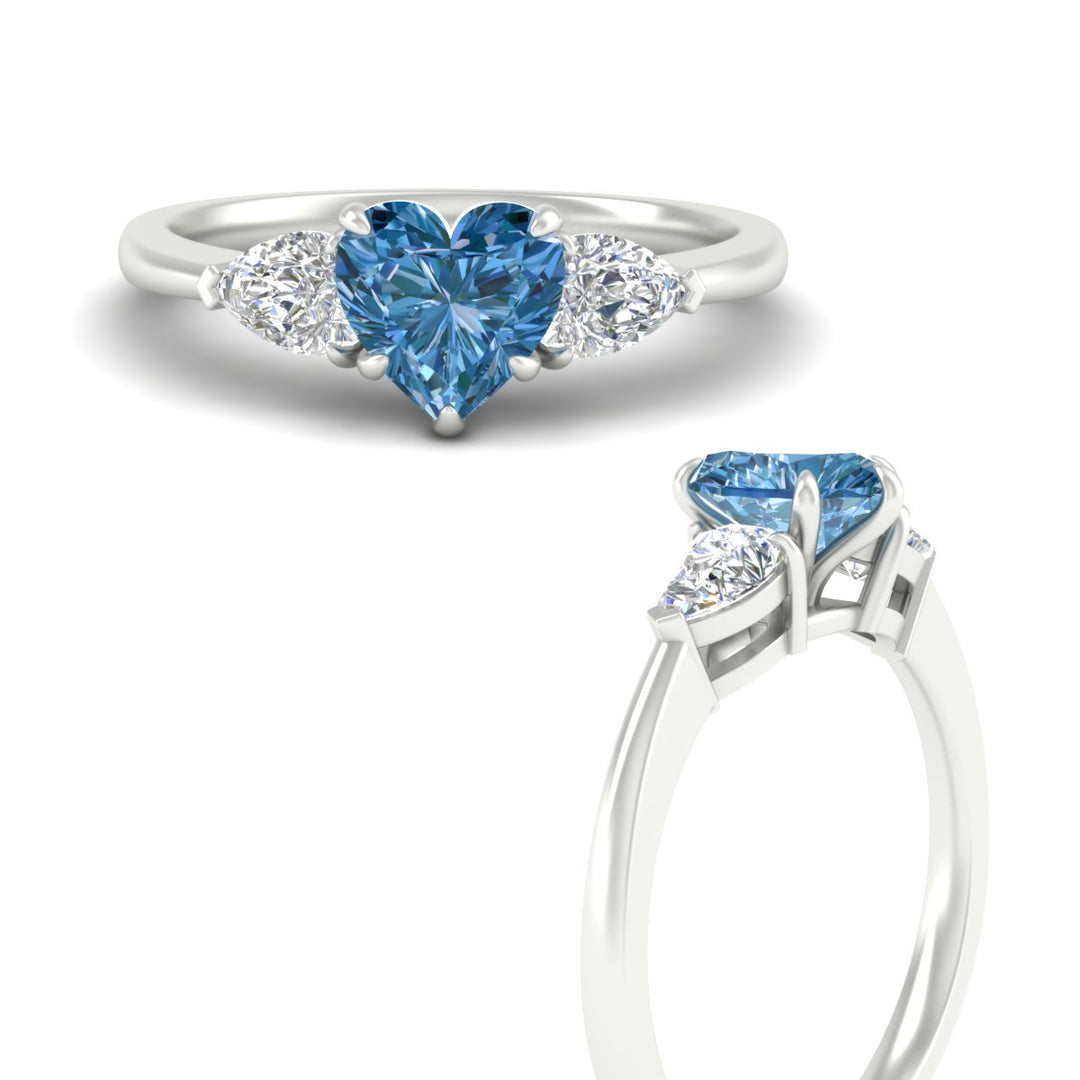 3-stone-vivid-blue-heart-shaped-cathedral-ring-in-white-gold-fdenr9210htgvblueangle3-nl-wg.jpg