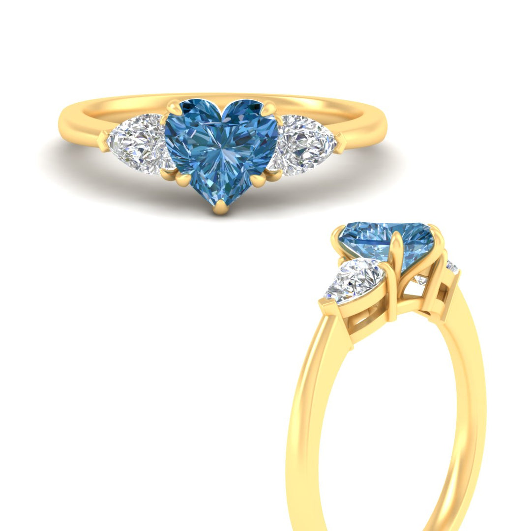 3-stone-vivid-blue-heart-shaped-cathedral-ring-in-yellow-gold-fdenr9210htgvblueangle3-nl-yg.jpg