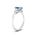 Load image into Gallery viewer, 3-stone-vivid-blue-marquise-cut-cathedral-ring-in-white-gold-fdenr9210mqgvblueangle2-nl-wg.jpg