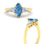 Load image into Gallery viewer, 3-stone-vivid-blue-marquise-cut-cathedral-ring-in-yellow-gold-fdenr9210mqgvblueangle3-nl-yg.jpg