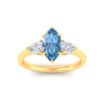 Load image into Gallery viewer, 3-stone-vivid-blue-marquise-cut-cathedral-ring-in-yellow-gold-fdenr9210mqgvblueangle5-nl-yg.jpg