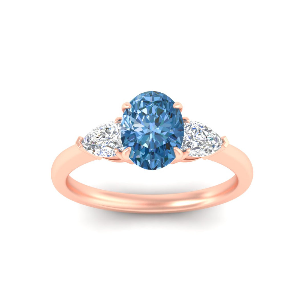3-stone-vivid-blue-oval-shaped-cathedral-ring-in-rose-gold-fdenr9210ovgvblueangle5-nl-rg.jpg