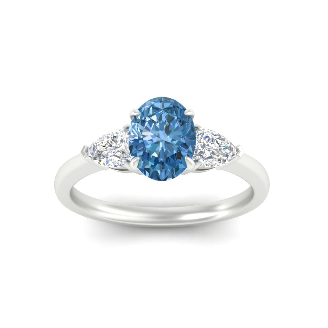 3-stone-vivid-blue-oval-shaped-cathedral-ring-in-white-gold-fdenr9210ovgvblueangle5-nl-wg.jpg