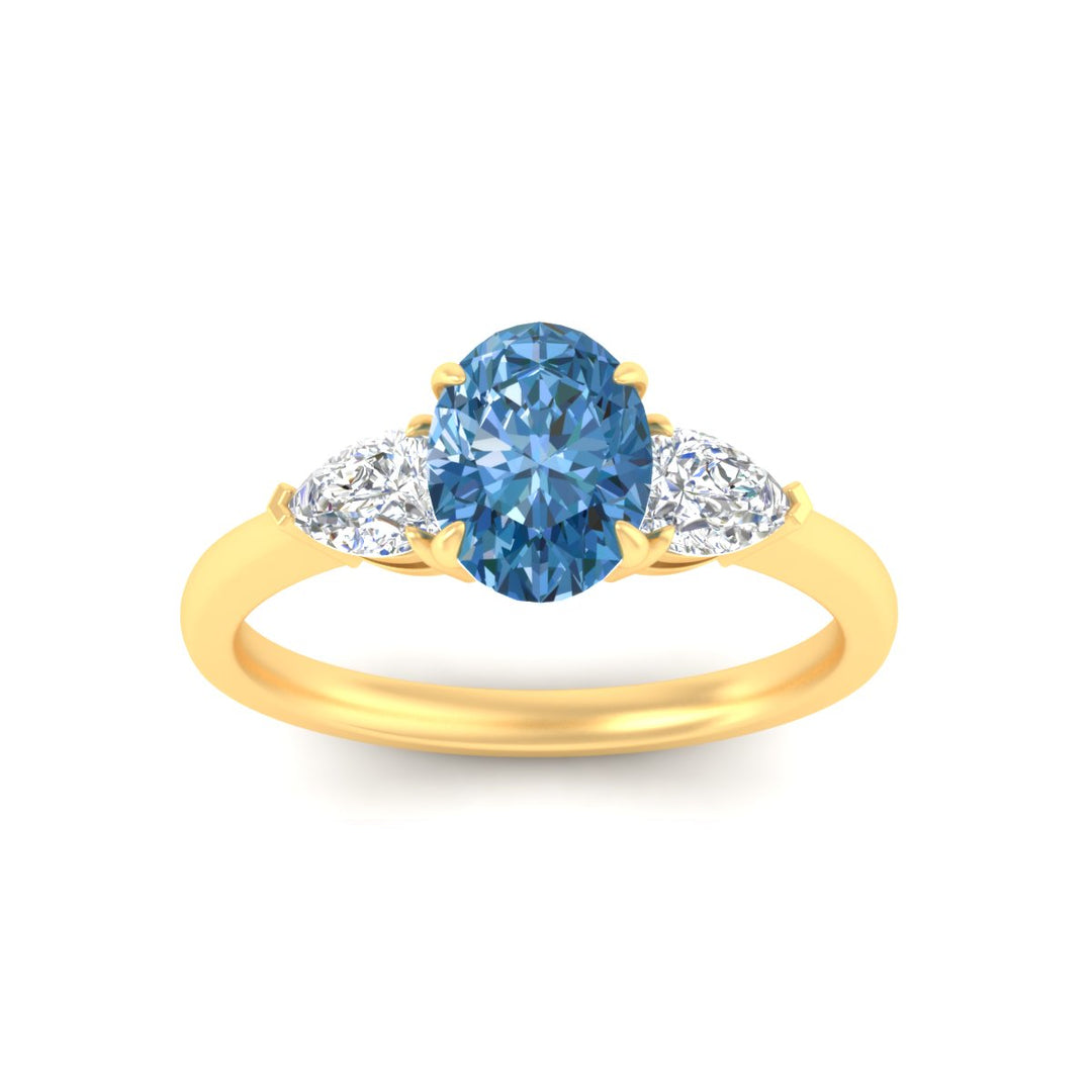3-stone-vivid-blue-oval-shaped-cathedral-ring-in-yellow-gold-fdenr9210ovgvblueangle5-nl-yg.jpg