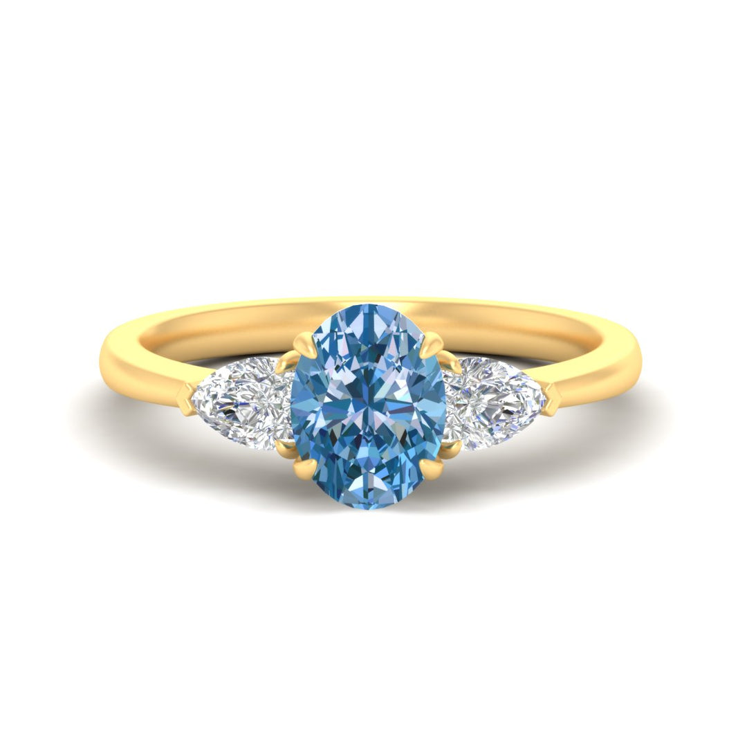 3-stone-vivid-blue-oval-shaped-cathedral-ring-in-yellow-gold-fdenr9210ovgvbluesleep-nl-yg.jpg