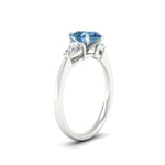 Load image into Gallery viewer, 3-stone-vivid-blue-pear-shaped-cathedral-ring-in-white-gold-fdenr9210pegvblueangle2-nl-wg.jpg