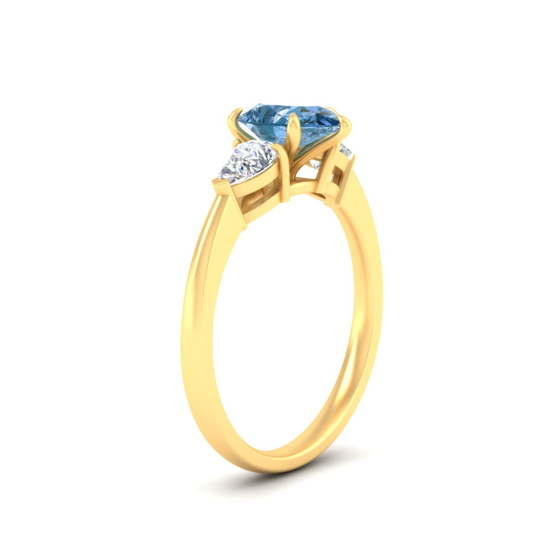 3-stone-vivid-blue-pear-shaped-cathedral-ring-in-yellow-gold-fdenr9210pegvblueangle2-nl-yg.jpg