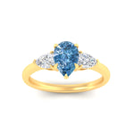 Load image into Gallery viewer, 3-stone-vivid-blue-pear-shaped-cathedral-ring-in-yellow-gold-fdenr9210pegvblueangle5-nl-yg.jpg