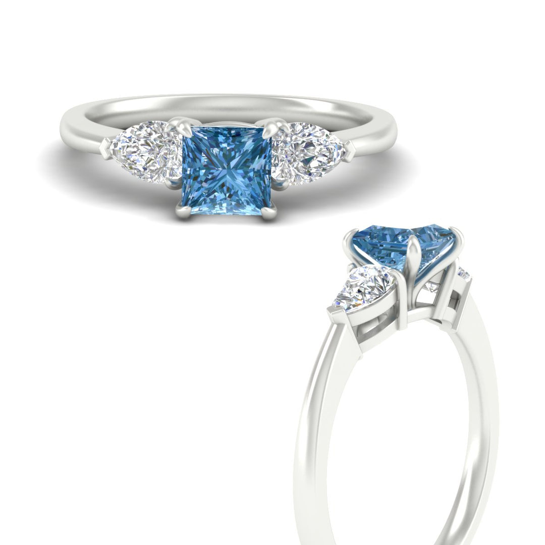 3-stone-vivid-blue-princess-cut-cathedral-ring-in-white-gold-fdenr9210prgvblueangle3-nl-wg.jpg