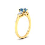 Load image into Gallery viewer, 3-stone-vivid-blue-princess-cut-cathedral-ring-in-yellow-gold-fdenr9210prgvblueangle2-nl-yg.jpg