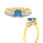 Load image into Gallery viewer, 3-stone-vivid-blue-princess-cut-cathedral-ring-in-yellow-gold-fdenr9210prgvblueangle3-nl-yg.jpg