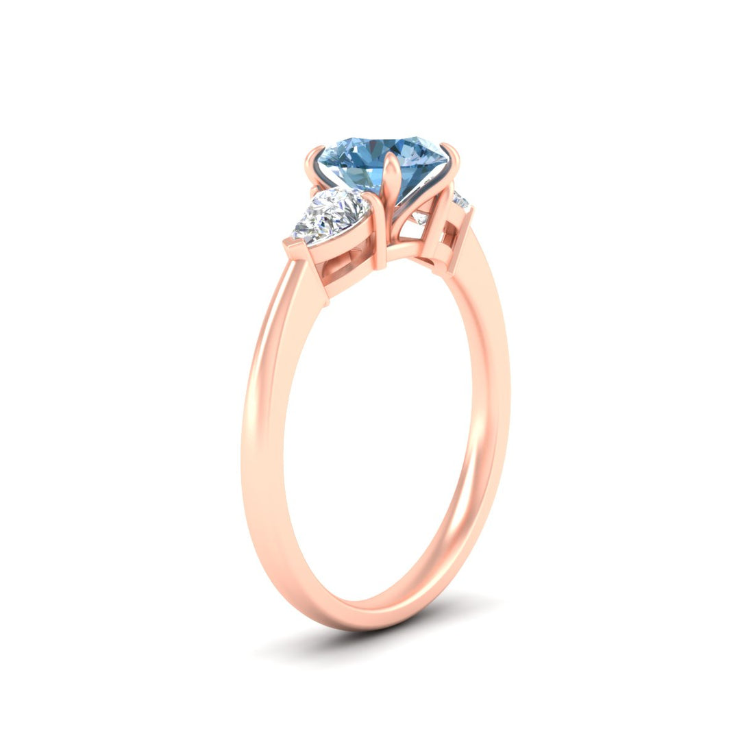 3-stone-vivid-blue-round-cut-cathedral-ring-in-rose-gold-fdenr9210rogvblueangle2-nl-rg.jpg