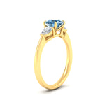 Load image into Gallery viewer, 3-stone-vivid-blue-round-cut-cathedral-ring-in-yellow-gold-fdenr9210rogvblueangle2-nl-yg.jpg