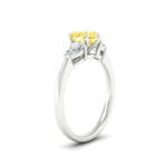 Load image into Gallery viewer, 3-stone-vivid-yellow-heart-shaped-cathedral-ring-in-white-gold-fdenr9210htgvyellowangle2-nl-wg.jpg