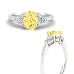 Load image into Gallery viewer, 3-stone-vivid-yellow-oval-shaped-cathedral-ring-in-white-gold-fdenr9210ovgvyellowangle3-nl-wg.jpg