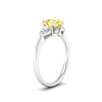 Load image into Gallery viewer, 3-stone-vivid-yellow-pear-shaped-cathedral-ring-in-white-gold-fdenr9210pegvyellowangle2-nl-wg.jpg
