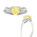 Load image into Gallery viewer, 3-stone-vivid-yellow-round-cut-cathedral-ring-in-white-gold-fdenr9210rogvyellowangle3-nl-wg.jpg