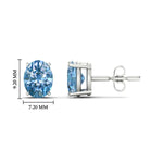Load image into Gallery viewer, 4-carat-oval-cut-vivid-blue-diamond-stud-earrings-in-white-gold-fdear10411ovgvblueangle2-4.00ct-nl-wg-hw.jpg