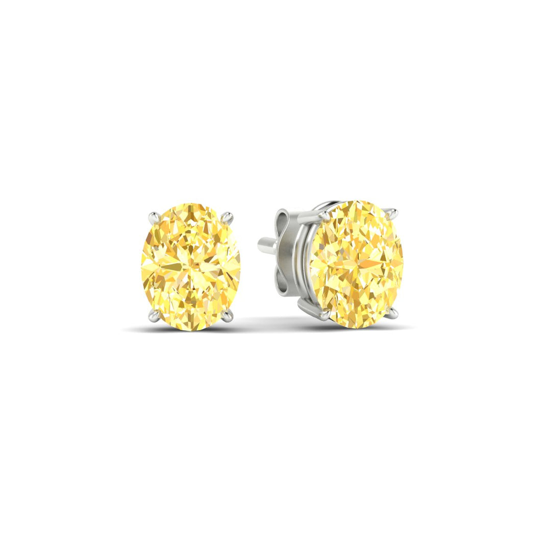 4-carat-oval-cut-vivid-yellow-diamond-stud-earrings-in-white-gold-fdear10411ovgvyellowangle1-4.00ct-nl-wg.jpg
