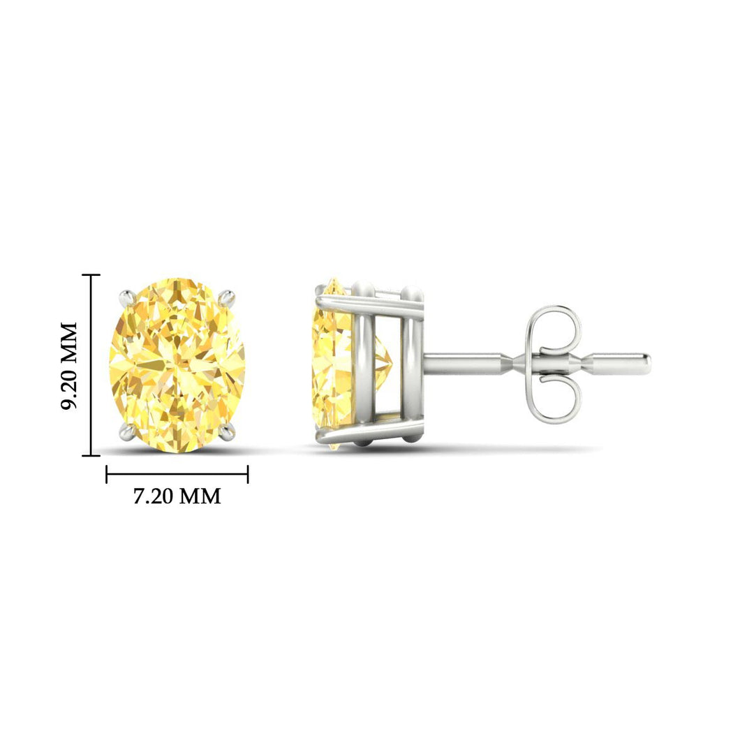 4-carat-oval-cut-vivid-yellow-diamond-stud-earrings-in-white-gold-fdear10411ovgvyellowangle2-4.00ct-nl-wg-hw.jpg