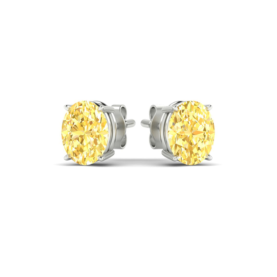 4-carat-oval-cut-vivid-yellow-diamond-stud-earrings-in-white-gold-fdear10411ovgvyellowangle3-4.00ct-nl-wg.jpg