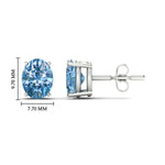 Load image into Gallery viewer, 5-carat-oval-cut-vivid-blue-diamond-stud-earrings-in-white-gold-fdear10411ovgvblueangle2-5.00ct-nl-wg-hw.jpg