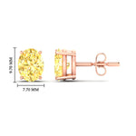 Load image into Gallery viewer, 5-carat-oval-cut-vivid-yellow-diamond-stud-earrings-in-rose-gold-fdear10411ovgvyellowangle2-5.00ct-nl-rg-hw.jpg