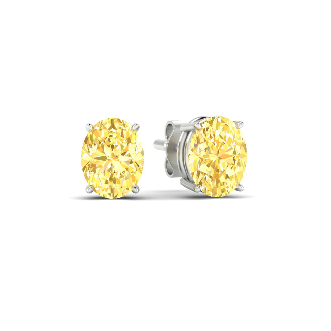 5-carat-oval-cut-vivid-yellow-diamond-stud-earrings-in-white-gold-fdear10411ovgvyellowangle1-5.00ct-nl-wg.jpg