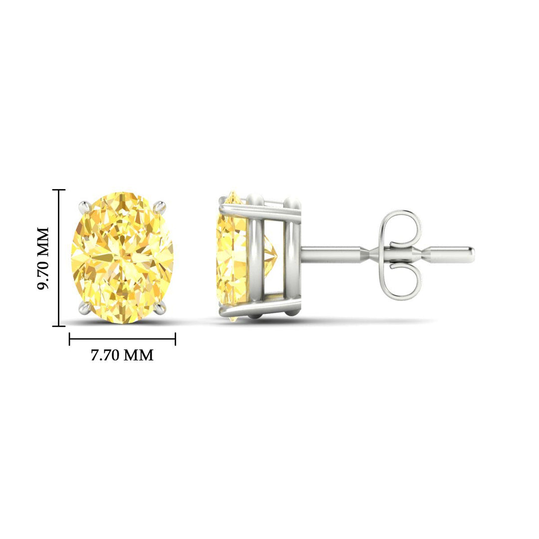 5-carat-oval-cut-vivid-yellow-diamond-stud-earrings-in-white-gold-fdear10411ovgvyellowangle2-5.00ct-nl-wg-hw.jpg