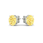 Load image into Gallery viewer, 5-carat-oval-cut-vivid-yellow-diamond-stud-earrings-in-white-gold-fdear10411ovgvyellowangle3-5.00ct-nl-wg.jpg