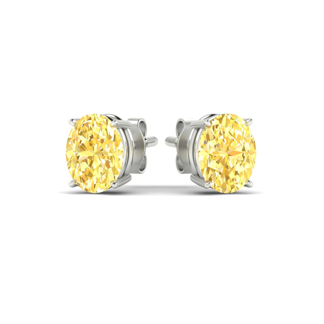 5-carat-oval-cut-vivid-yellow-diamond-stud-earrings-in-white-gold-fdear10411ovgvyellowangle3-5.00ct-nl-wg.jpg
