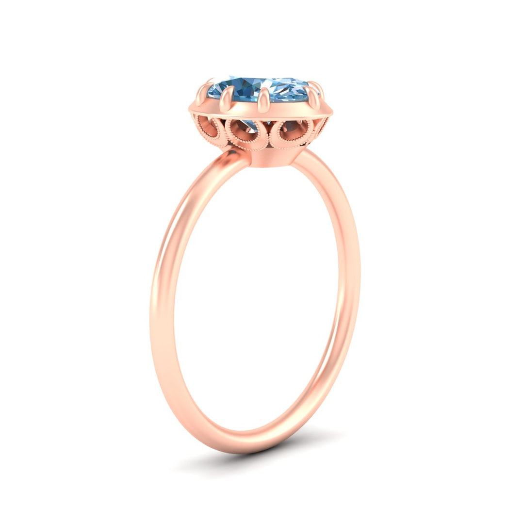 antique-style-oval-vivid-blue-bezel-solitaire-engagement-ring-in-rose-gold-fdenr11614ovgvblueangle2-nl-rg.jpg