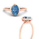 Load image into Gallery viewer, antique-style-oval-vivid-blue-bezel-solitaire-engagement-ring-in-rose-gold-fdenr11614ovgvblueangle3-nl-rg.jpg