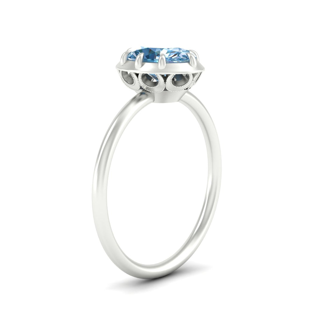 antique-style-oval-vivid-blue-bezel-solitaire-engagement-ring-in-white-gold-fdenr11614ovgvblueangle2-nl-wg.jpg
