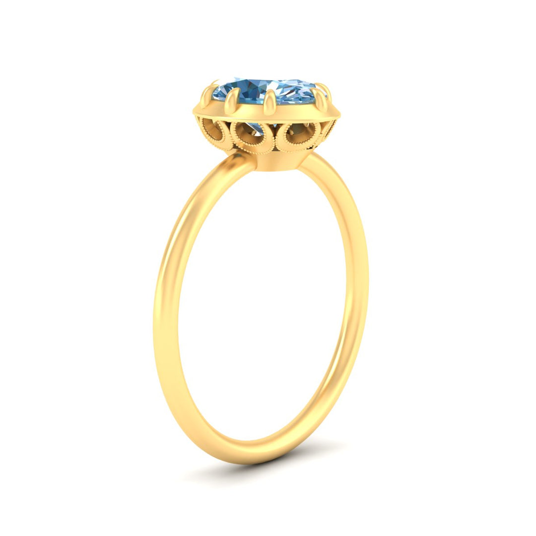 antique-style-oval-vivid-blue-bezel-solitaire-engagement-ring-in-yellow-gold-fdenr11614ovgvblueangle2-nl-yg.jpg