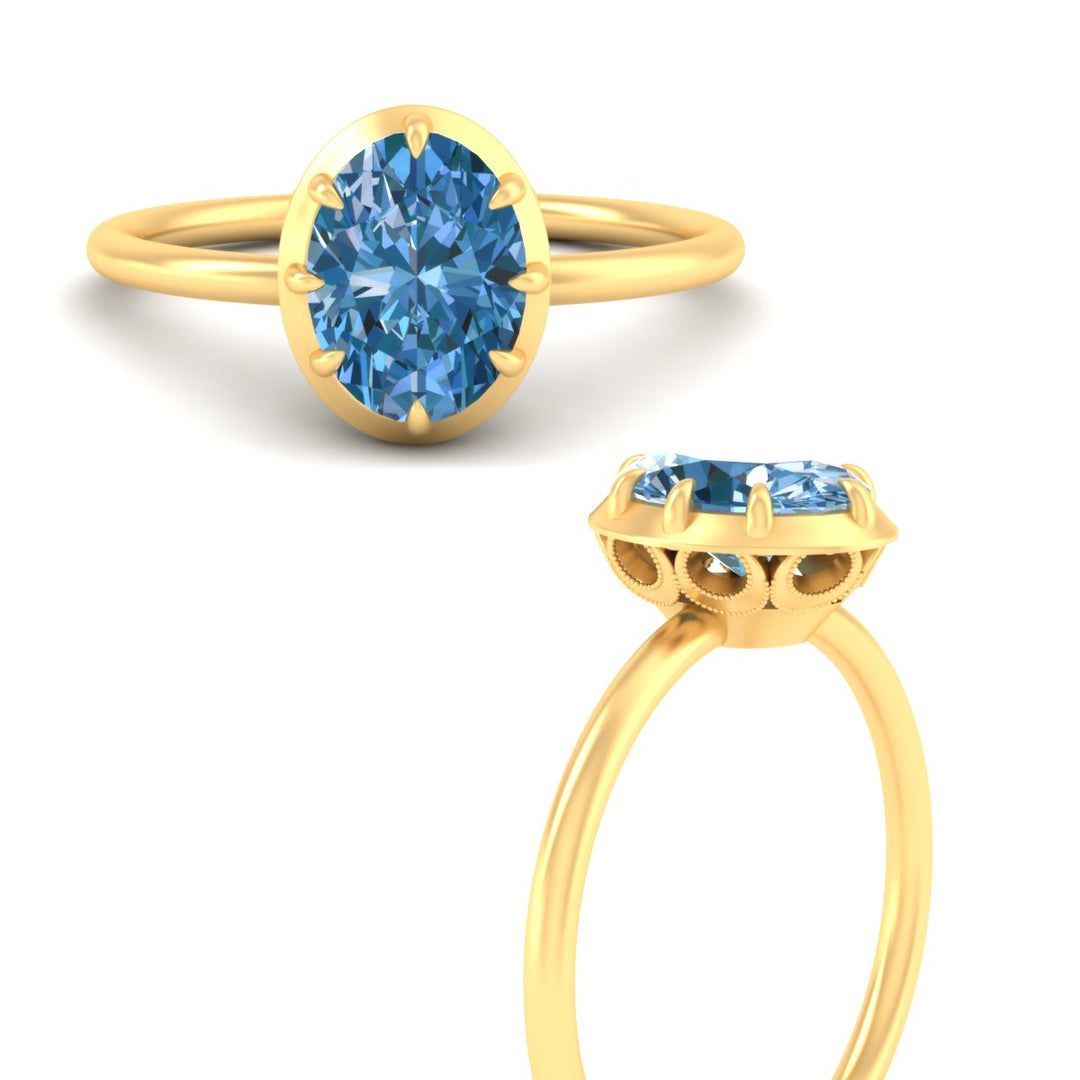 antique-style-oval-vivid-blue-bezel-solitaire-engagement-ring-in-yellow-gold-fdenr11614ovgvblueangle3-nl-yg.jpg
