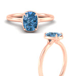 Load image into Gallery viewer, cushion-cut-collet-set-solitaire-vivid-blue-engagement-ring-in-rose-gold-fdenr11593cugvblueangle3-nl-rg.jpg